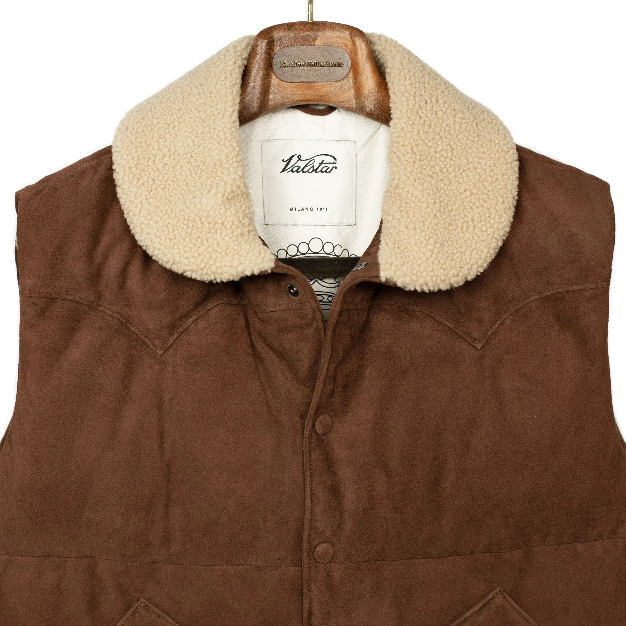 Down-filled vest in brown suede