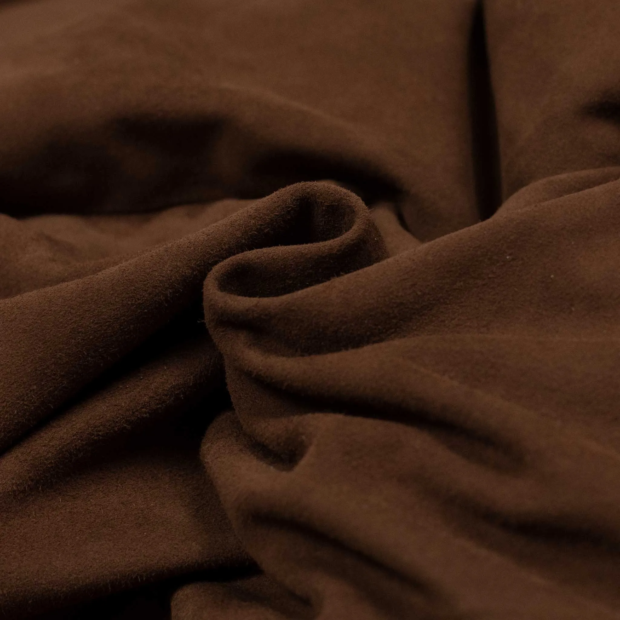 Down-filled vest in brown suede