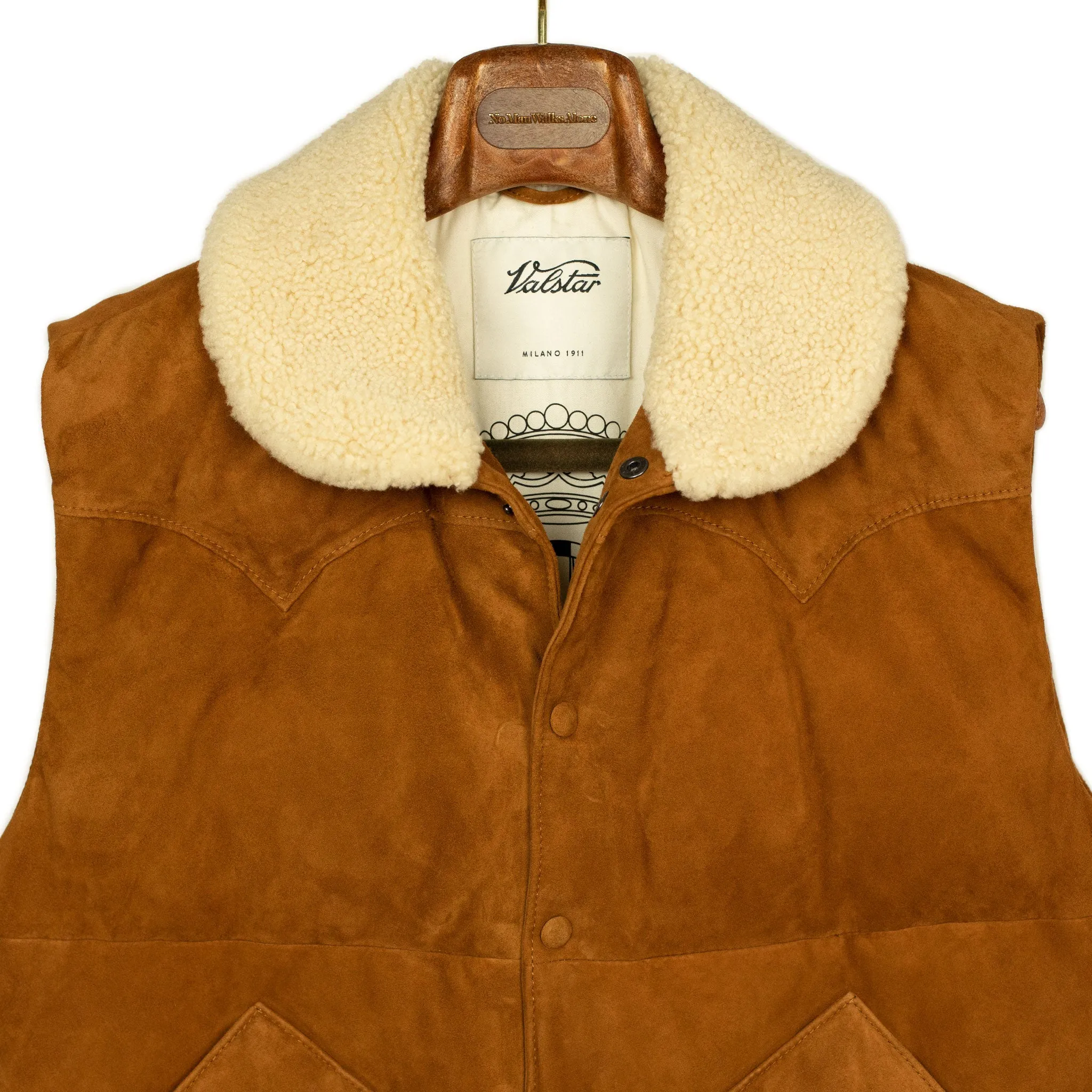 Down-filled vest in tan suede